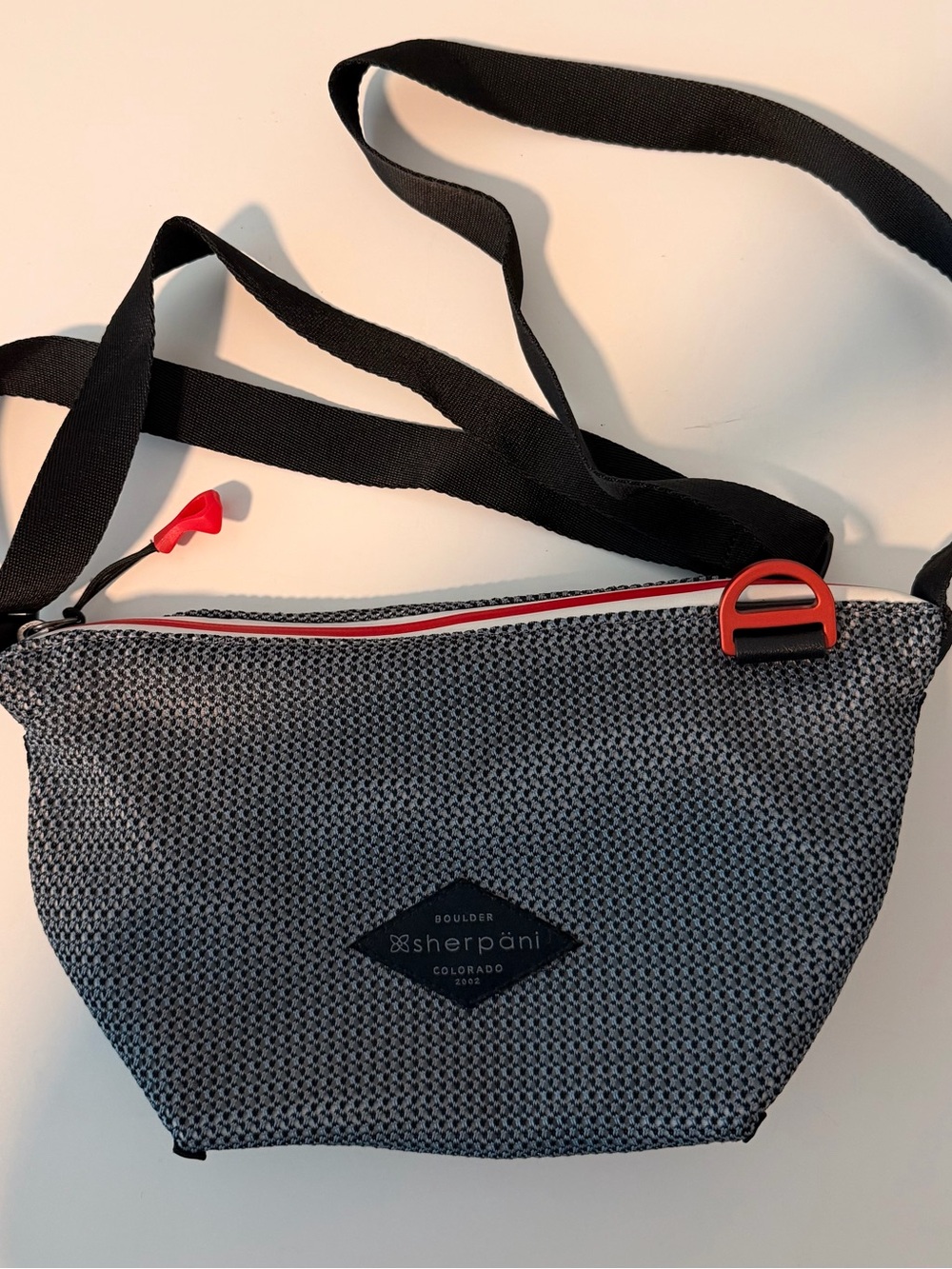 Sherpani Demi Gray Crossbody with Red Accents and Black Strap